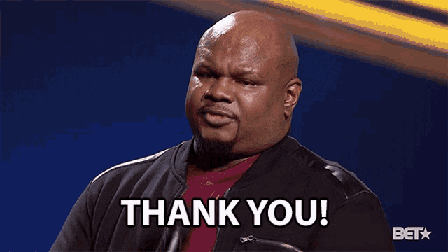 a man with a microphone says thank you