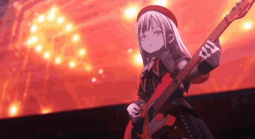 a girl is playing a guitar on a stage in front of a crowd .