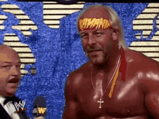 a wrestler with a headband that says hulk hogan