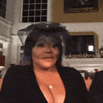 a woman wearing a black veil and a necklace