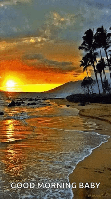 a sunset on a beach with the words good morning baby below it