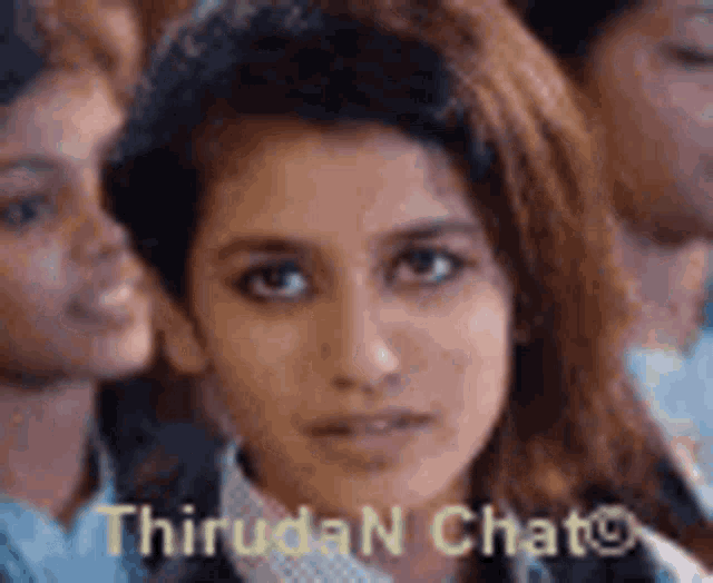 a close up of a woman 's face with the words thiruda n chat written on the bottom .