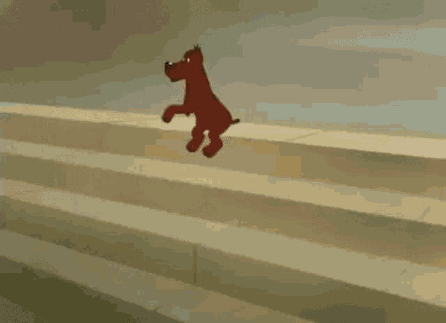 a cartoon mouse is walking down a set of stairs next to a red ball and a mushroom .