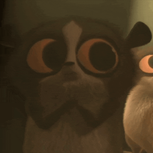 a close up of a cartoon owl with large eyes