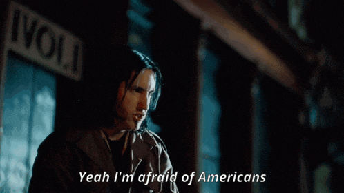 a yellow car with the words yeah i 'm afraid of americans written below it