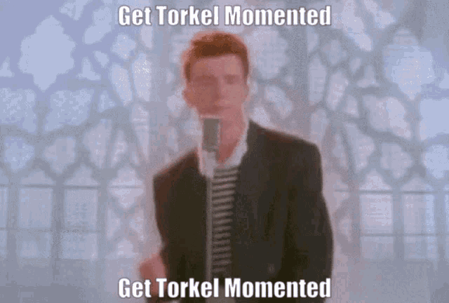 a man singing into a microphone with the words get torkel momented