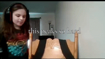 a girl wearing headphones is sitting in a chair with the words " this peaks so hard " on the bottom