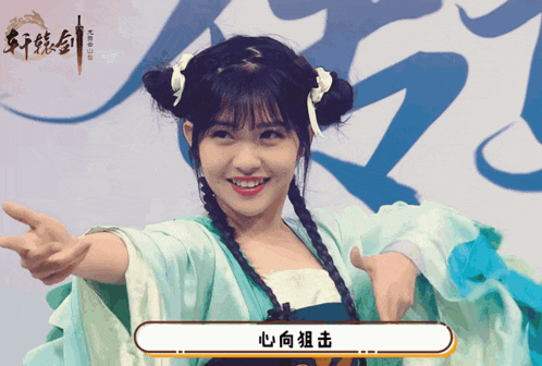 a woman in a blue dress with chinese writing on the bottom
