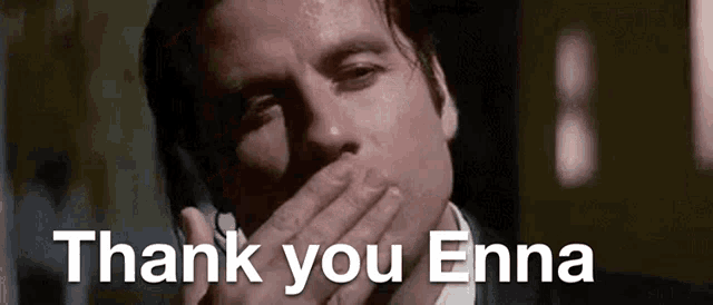 a man is covering his mouth with his hand while talking on a cell phone and the words thank you enna are below him .