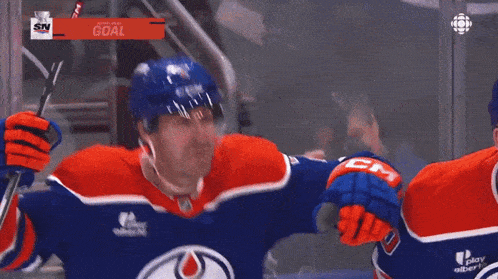 a hockey player with the word oilers on his shirt