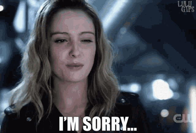 a woman says i 'm sorry in front of a clu logo