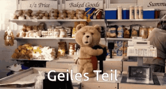 a teddy bear in a store with the words geiles teil on the bottom