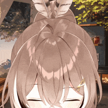 a close up of a girl 's hair with a feather in it