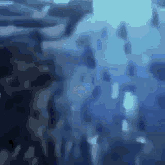 a blurry picture of a body of water with bubbles coming out of it