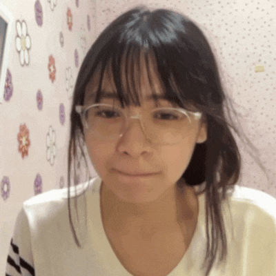 a young girl wearing glasses and a white shirt