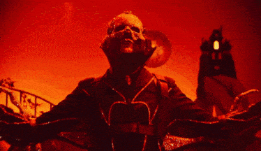 a man in a black jacket with rhinestones on it