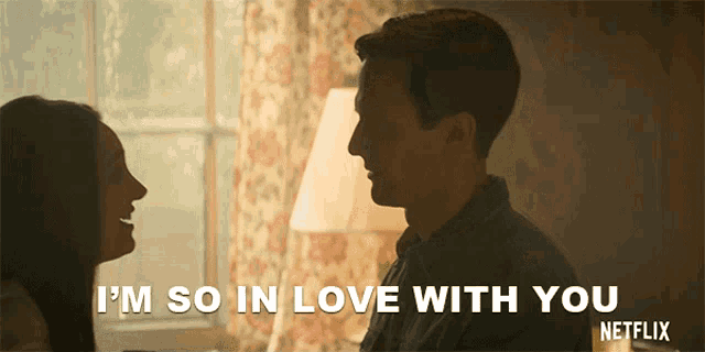 a man and a woman are looking at each other and the man says i 'm so in love with you netflix