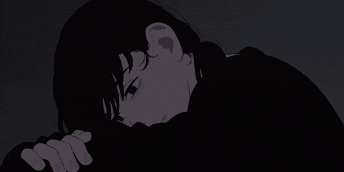 a person 's hand is holding another person 's hand in a dark room