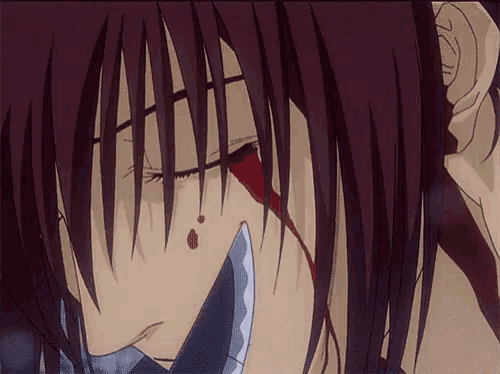 a close up of a person 's face with a knife in it