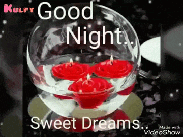 a glass bowl filled with red candles and the words `` good night , sweet dreams '' .