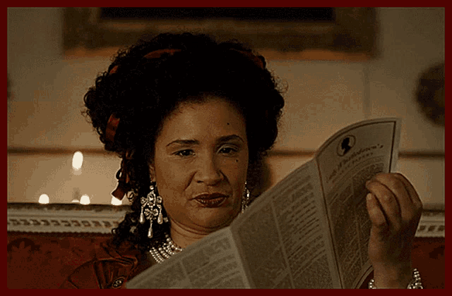 a woman is reading a pamphlet that says ' ladies of philadelphia ' on the front