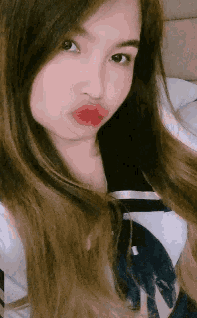 a woman with red lipstick on her lips