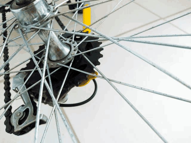 a close up of a bicycle wheel with a derailleur that says ' shimano ' on it
