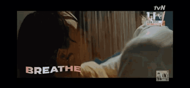 a man and woman kissing with the words breathe written on the bottom