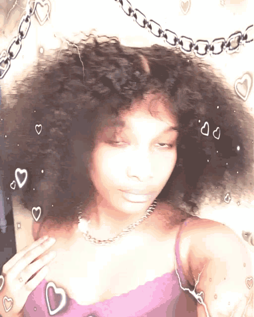 a woman in a purple tank top with hearts around her