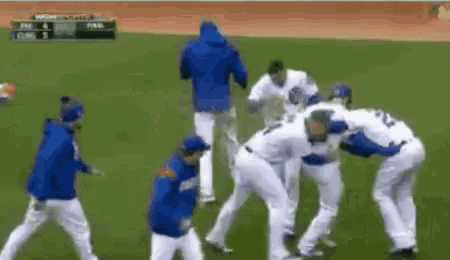 a group of baseball players are standing on a field and one of them has the number 22 on his back .