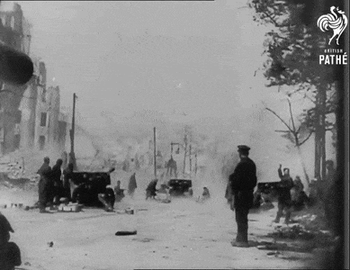 a black and white photo of soldiers in a war scene taken by the pathe