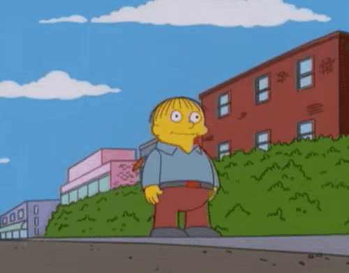 a cartoon character named ralph from the simpsons is standing on the sidewalk