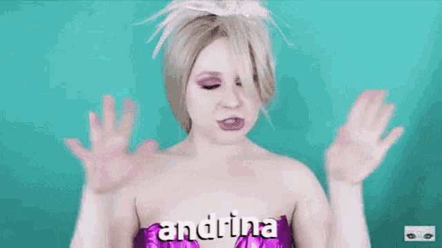 a woman in a purple dress with the word andrina written on her chest