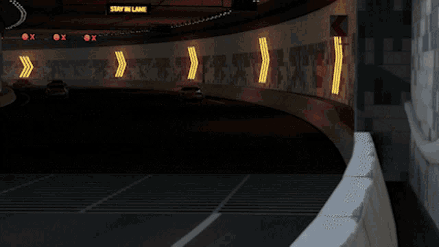 three red cars are driving down a highway under a bridge that says al barsha toll gate