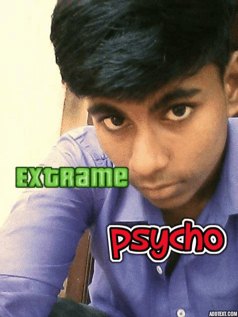 a boy in a blue shirt with the words extrame psycho written on his face