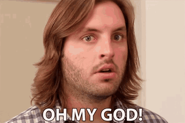 a man with long hair and beard says oh my god