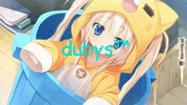 a girl in a yellow cat hoodie is sitting in a blue bucket with the word dubs on her face