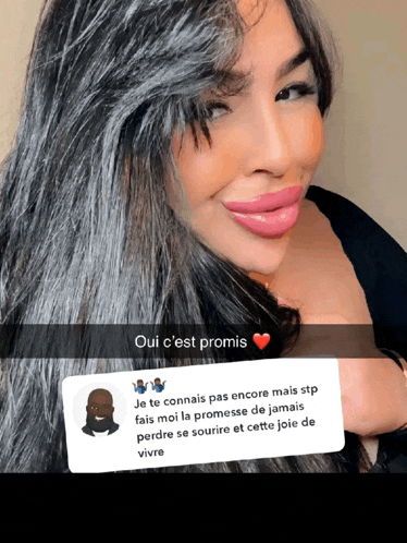 a woman with long black hair is smiling with a snapchat message in front of her that says oui c'est promis