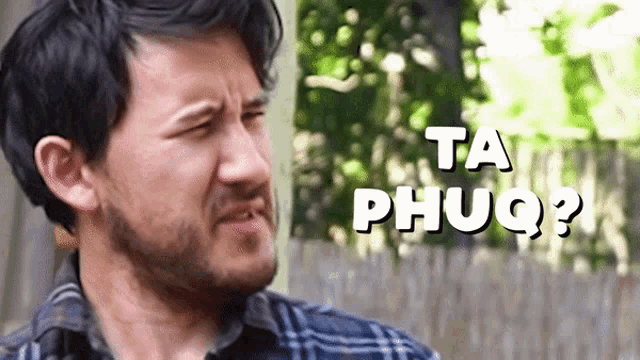 a man with a beard is making a funny face and the words ta phuq are behind him
