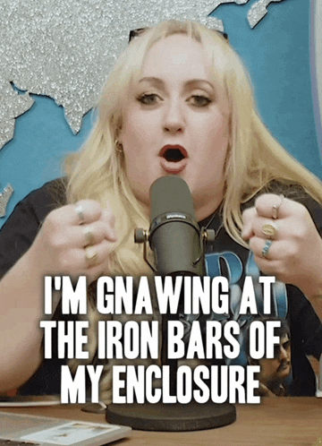 a woman speaking into a microphone with the words " i 'm gnawing at the iron bars of my enclosure " below her