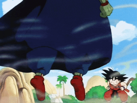a cartoon of a boy holding a sword standing next to a giant man