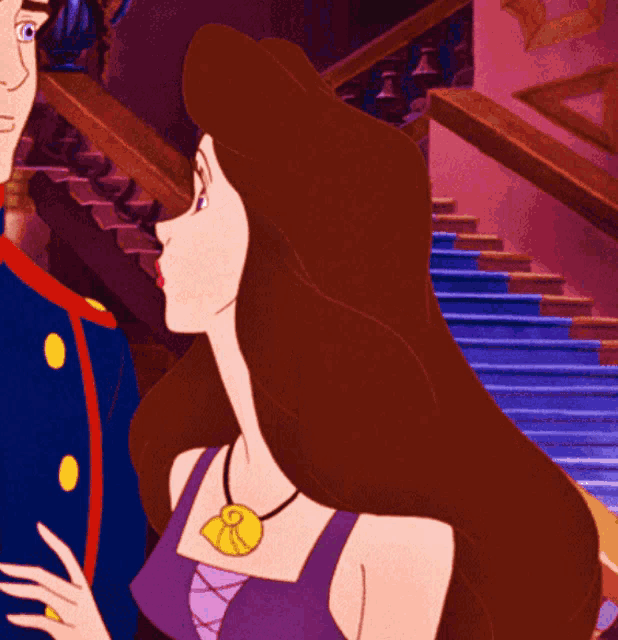 a woman in a purple top has a necklace with a pendant that says r on it