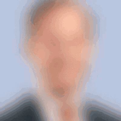 a blurry picture of a man in a suit and tie with a blue background .