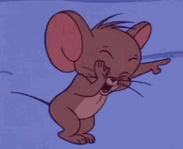 jerry from tom and jerry is yawning and pointing at something .