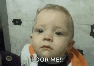 a baby is making a face and saying `` poor me '' .
