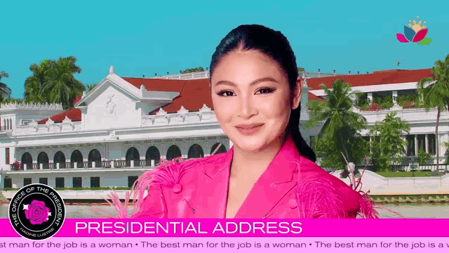 a woman in a pink jacket stands in front of a building with the words presidential address on the bottom