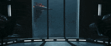 a room with a view of a space ship through a large window
