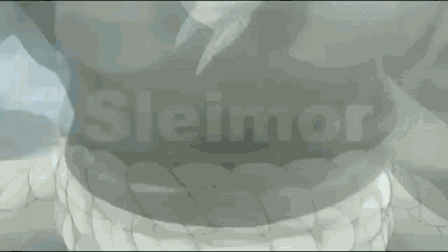 a close up of a person 's torso with the word sleimor written in the background