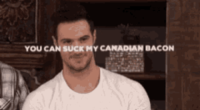 a man in a white shirt is smiling and says you can suck my canadian bacon .