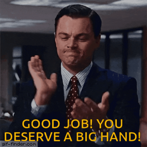 a man in a suit and tie applauds with the words " good job you deserve a big hand "